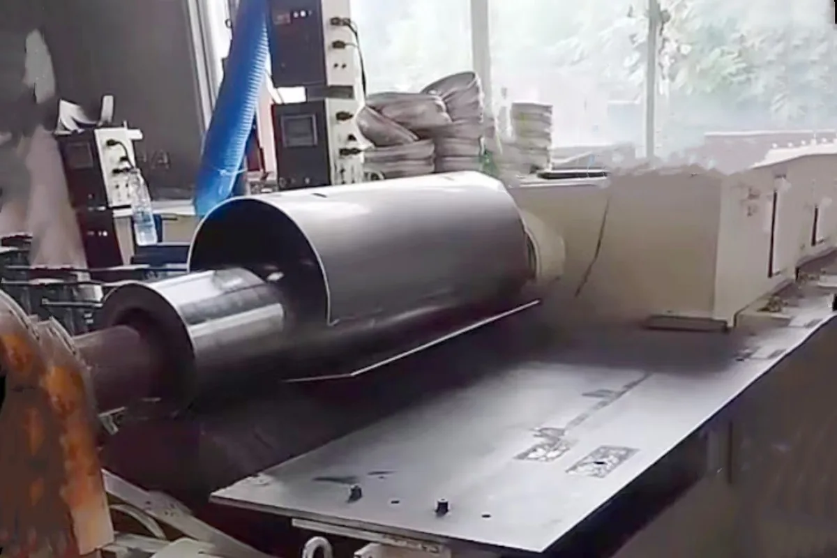 Cylindrical aluminum shell supported during a production stage